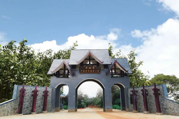 Ornate gray gateway featured in an article on Chen Sheng Hao and Lao Ban Zhang development
