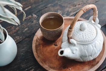 Ceramic teapot with woven handle for Pu Erh tea brewing and serving