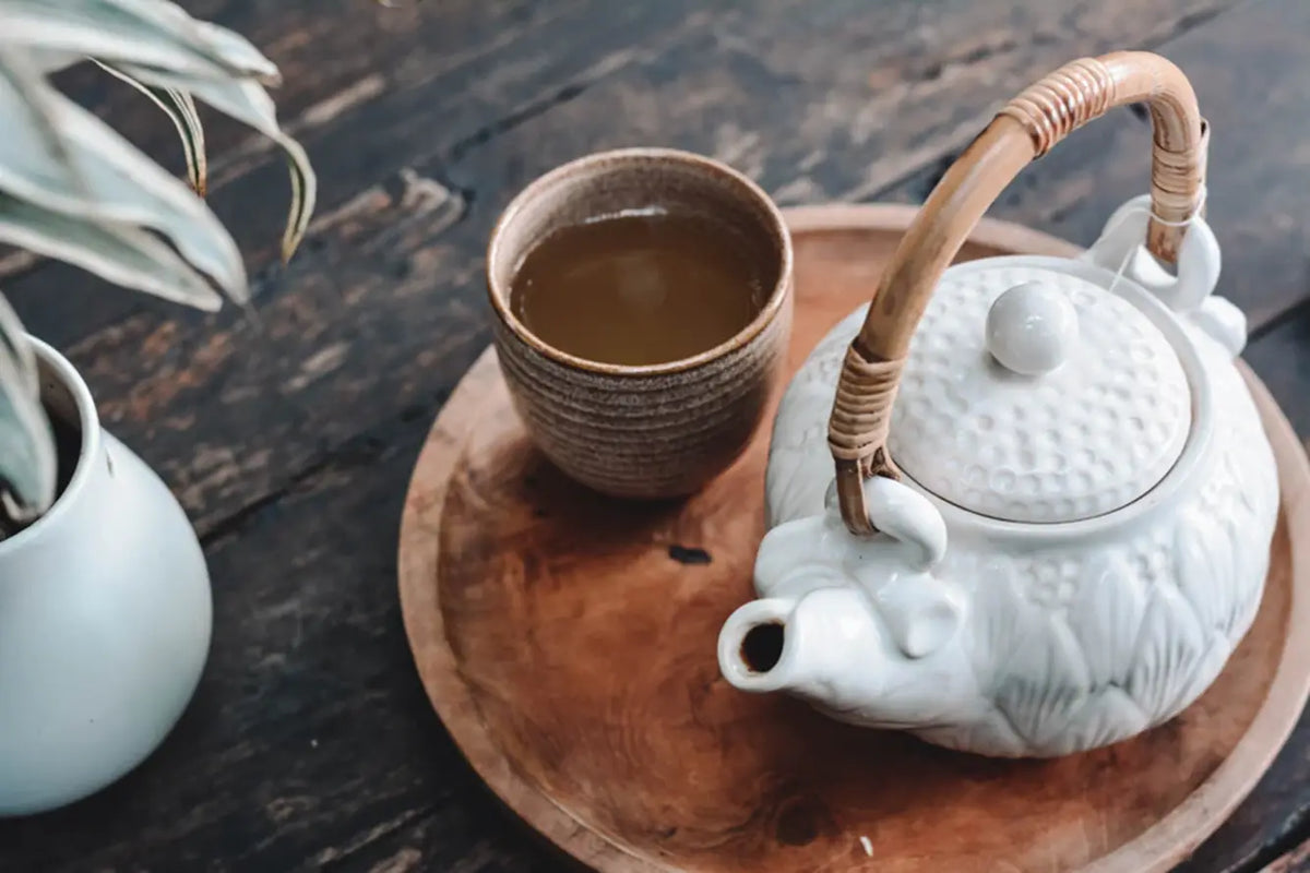 Ceramic teapot with woven handle for Pu Erh tea brewing and serving
