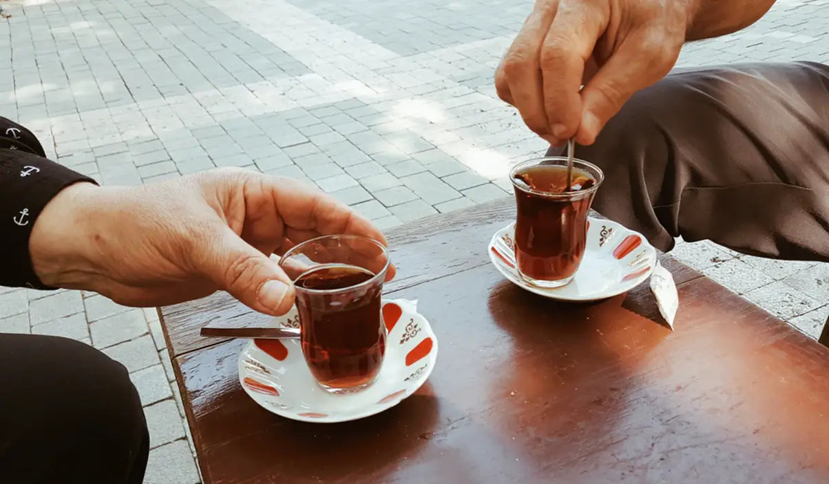 Two glasses of tea on a table for Tea and Oral Health Risks and Prevention article