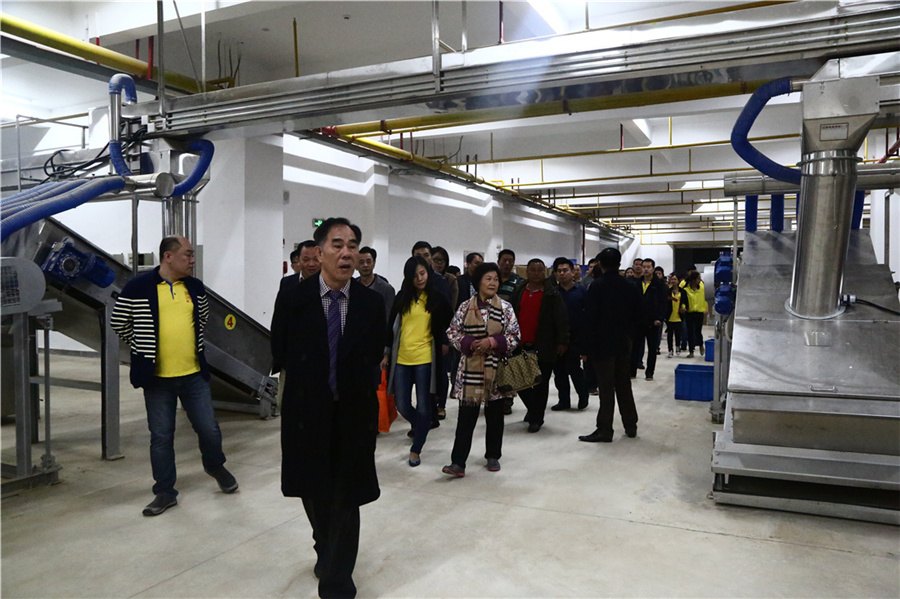 Guests tour the new production lines at the Chen Sheng Hao factory, November 2015