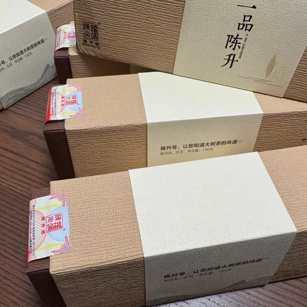 Stacked, brown, textured gift boxes with light-colored bands.
